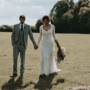 Real Australian bride wearing a fitted long sleeve lace wedding dress bought from Dreamers & Lovers in California