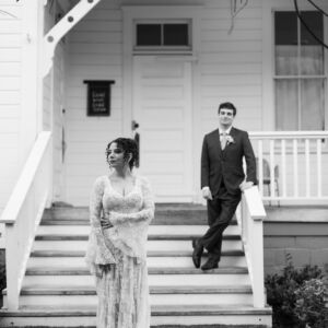 Bride Chelsea wearing the Allegra bell sleeve lace wedding dress by Dreamers & Lovers