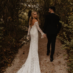Real bohemian bride wearing off shoulder fringe wedding dress